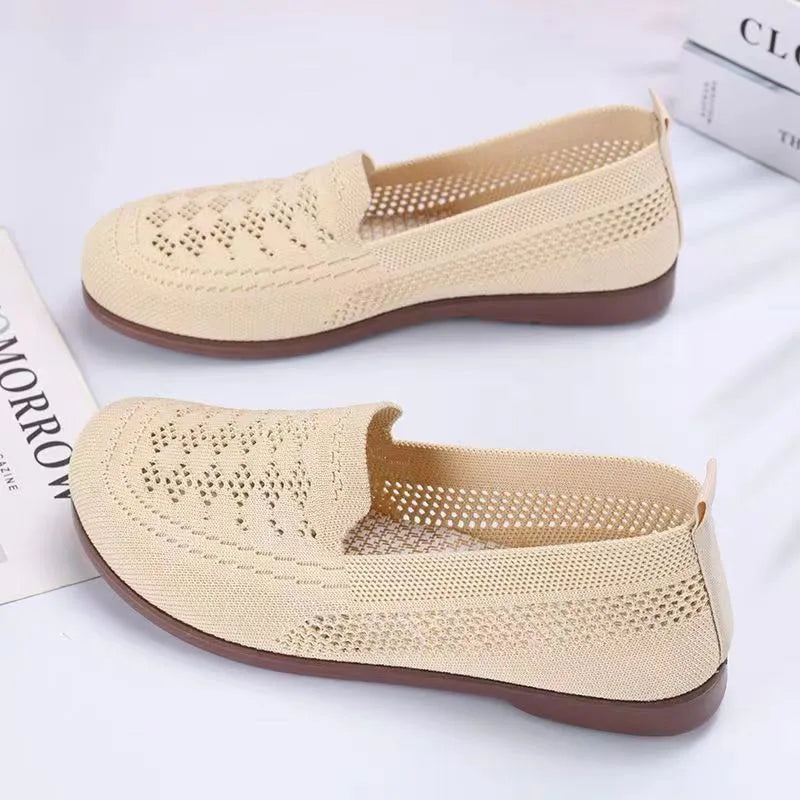 Beige women's low-top casual trainers with breathable Flyknit mesh and a flat antiskid PVC sole.