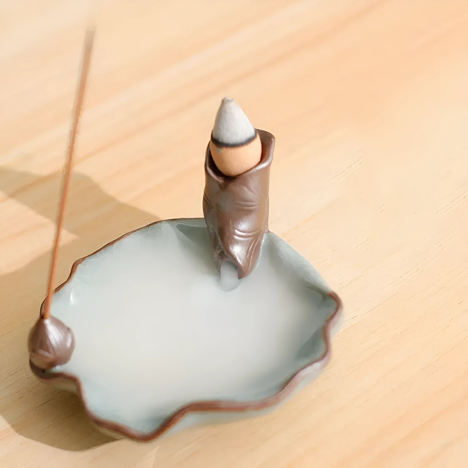Ceramic reverse flow incense burner with good luck patterns and lotus design in square form