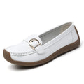 Women's beige casual loafers with round toe and flat heel on a light background.