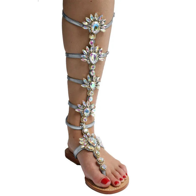 Women's flat roman-style sandals with rhinestone trim in blue artificial PU and rubber sole
