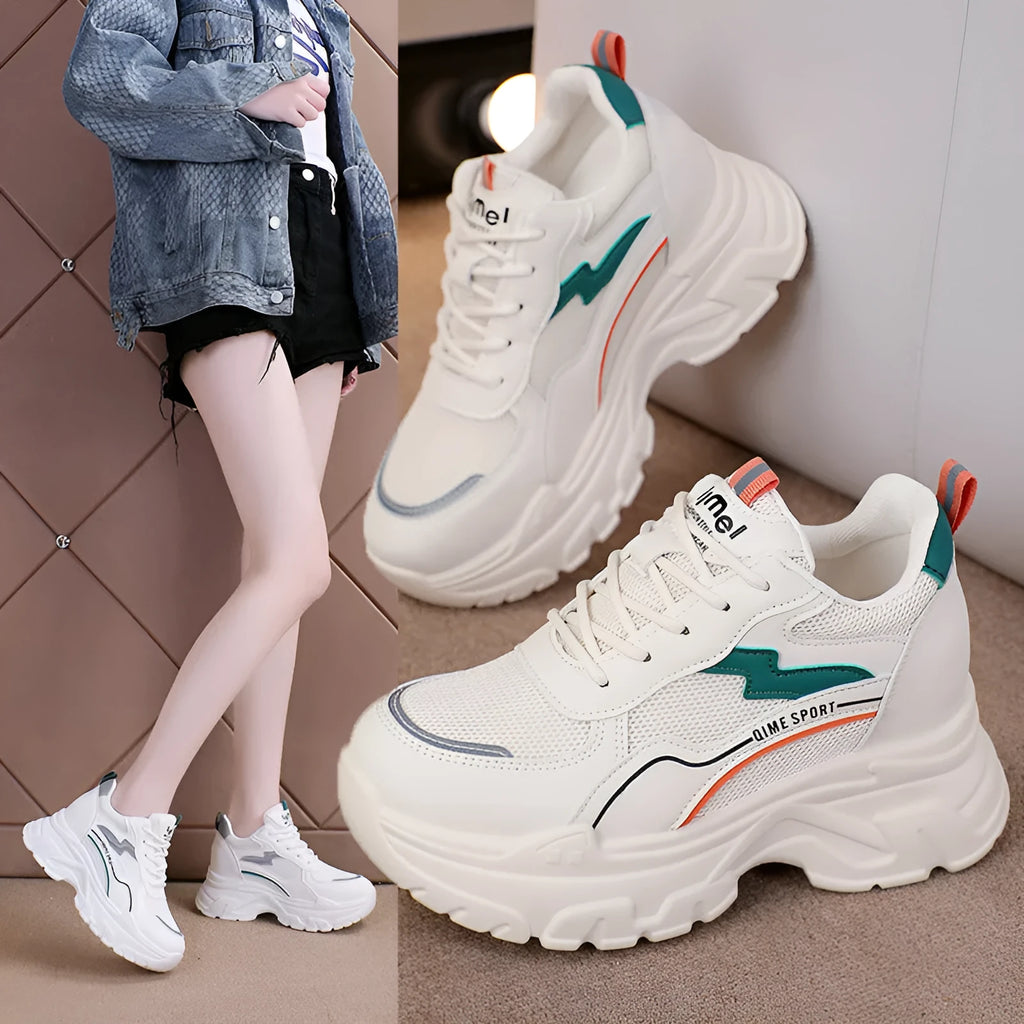 Women's white low-top sports dad shoes with cross strap and round toe, showcasing breathable mesh design.