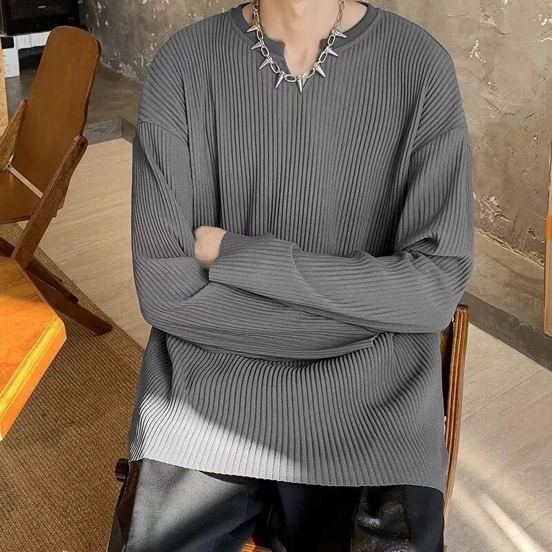 Plus size striped pullover top in black with long sleeves and loose fit