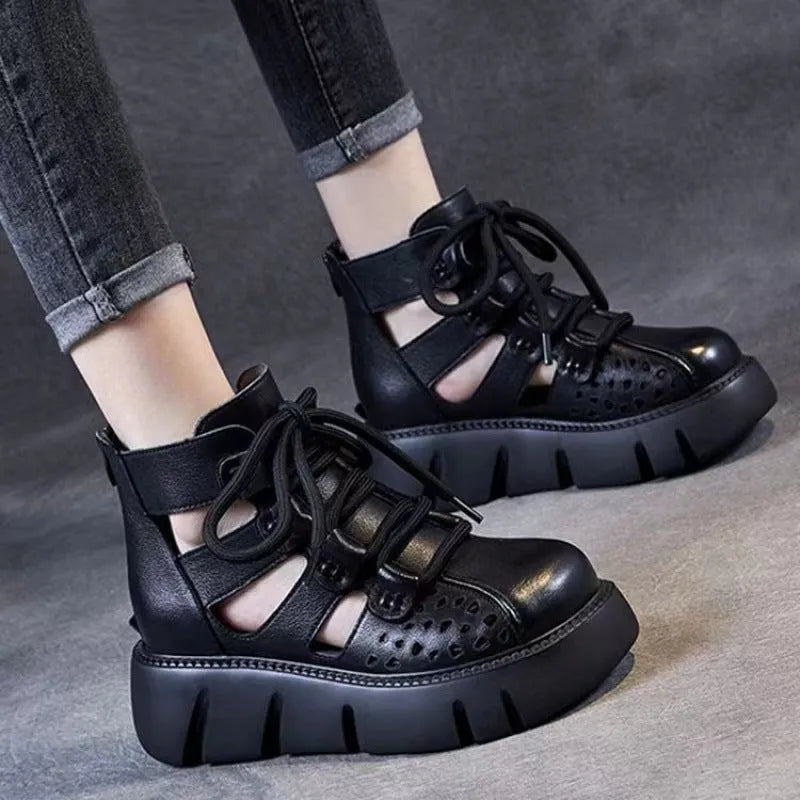 Women's black platform sandals with a hollow hole design and fish mouth toe, made from soft cowhide leather with a PU sole.
