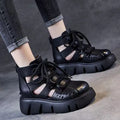 Women's black platform sandals with a hollow hole design and fish mouth toe, made from soft cowhide leather with a PU sole.