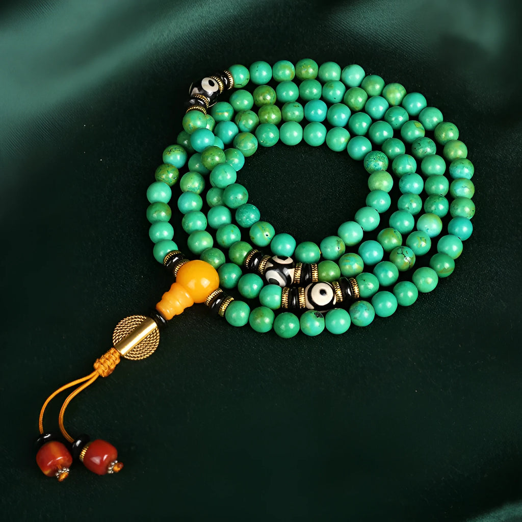Natural turquoise beaded bracelet with 108 polished 8mm round beads on a wrist.