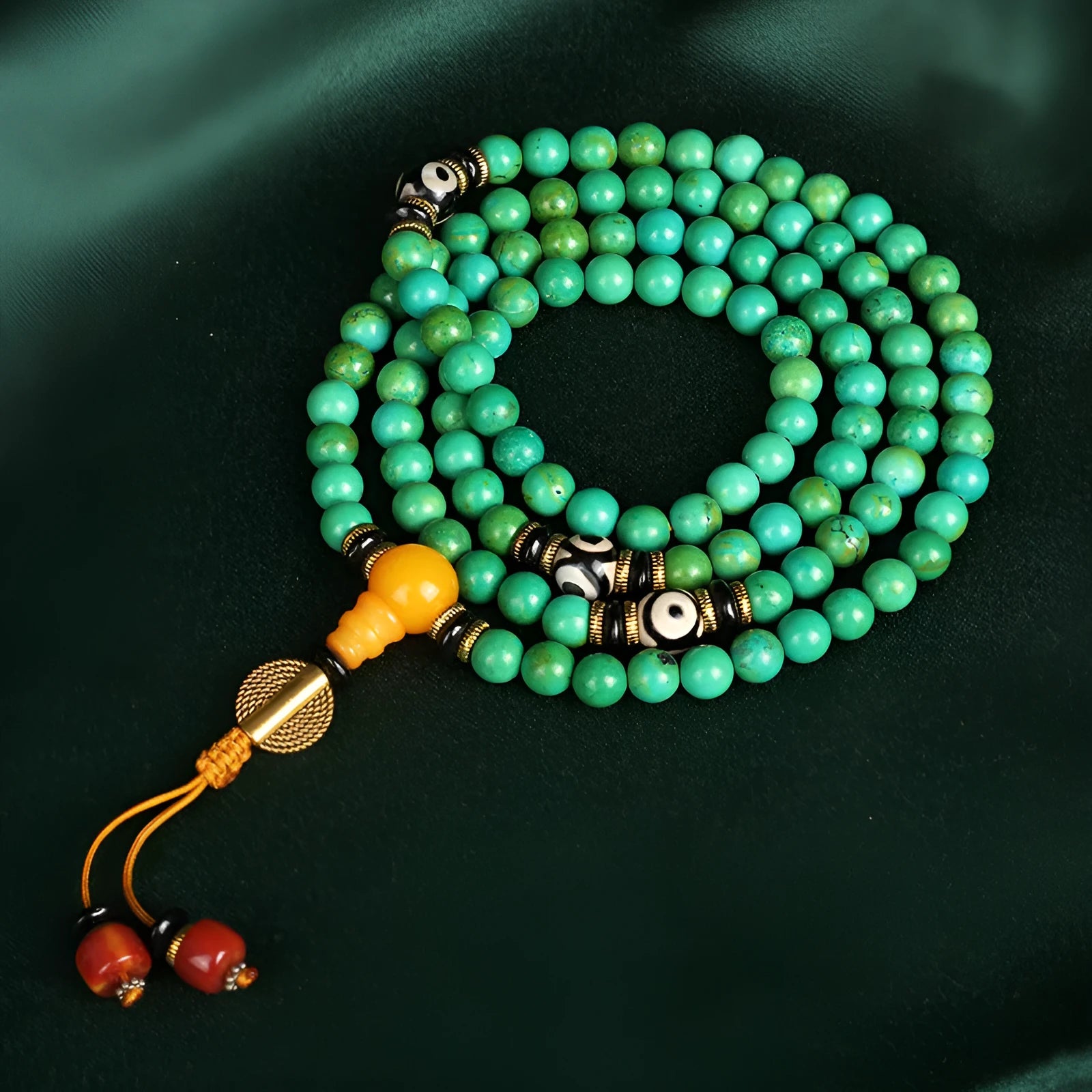 Natural turquoise beaded bracelet with 108 polished 8mm round beads on a wrist.