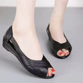 Women's casual peep toe sandals with a rubber mid heel and an ankle buckle strap.