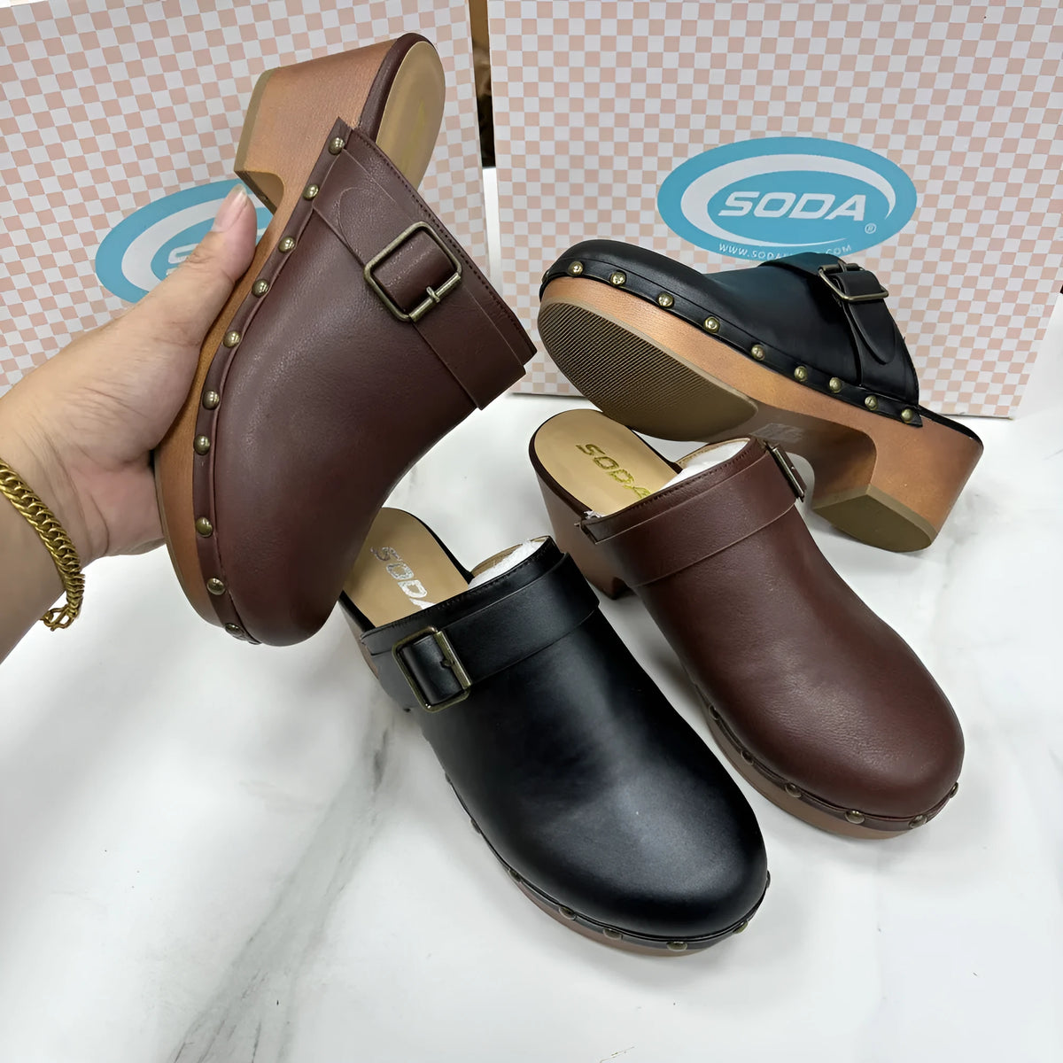 Black retro women's slippers with a chunky block heel, closed toe, rivet details, and a rubber sole.