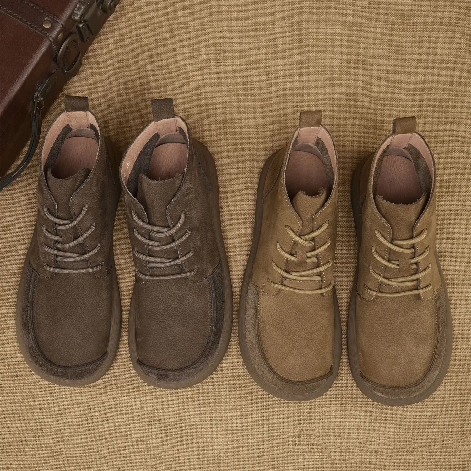 British style grey leather Martin boots with lace-up front and wedge heel on a rubber sole.