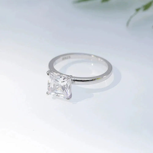 Simple geometric 925 sterling silver women's ring on a grey background, shown in silver, gold, and rose gold colour options.