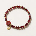 Women's adjustable freshwater pearl bracelet with crystal shapes on amethyst braided rope