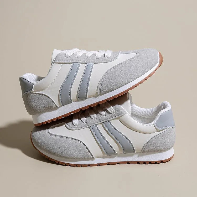 Blue and grey striped Cortez-style leisure sports shoes with a flat rubber sole.