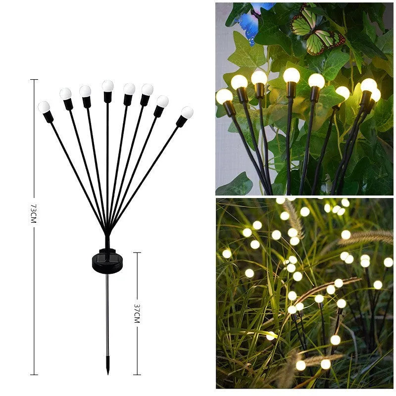 Solar-powered LED garden lamp with multiple light heads and ground plug stakes on a lawn