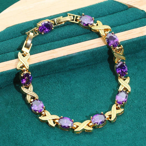 18k gold plated cubic zirconia jewellery set showing necklace, earrings, ring and bracelet in four colour options