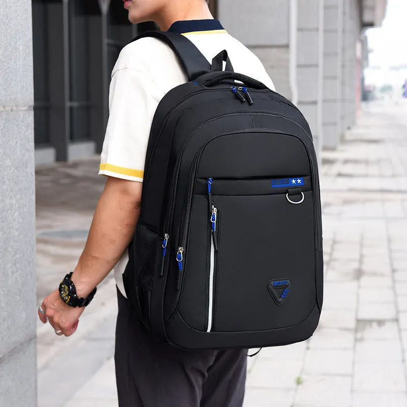 Men's large Oxford cloth schoolbag in red with letter pattern and burden reduction straps.
