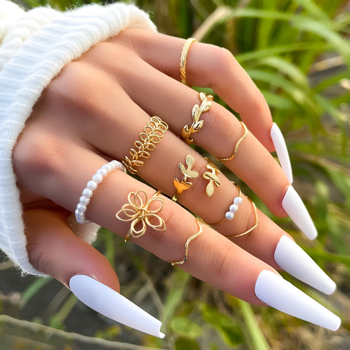 Gold coloured openwork floral design alloy ring set for women, showing glossy electroplated finish.
