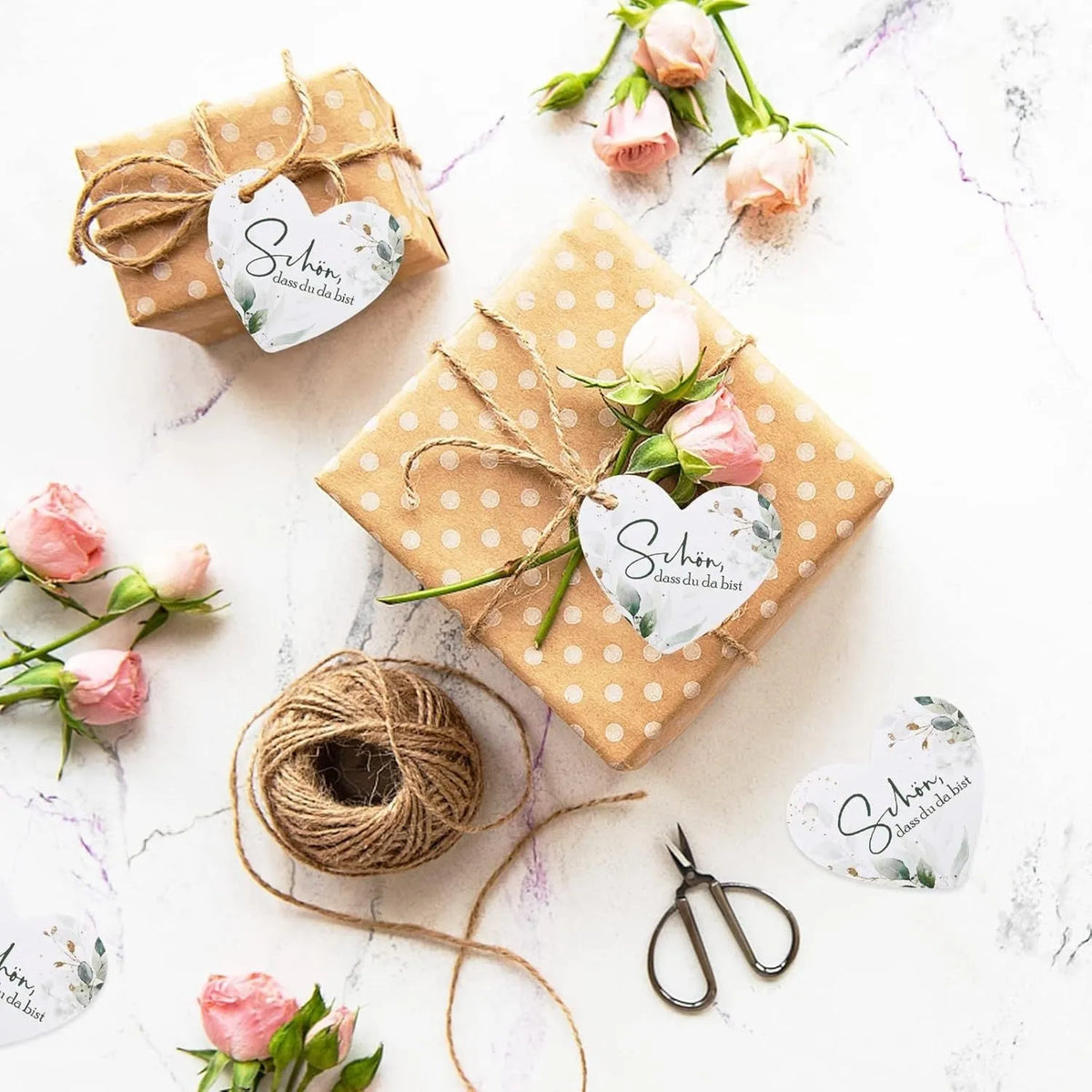 Set of 50 decorative flower heart-shaped paper gift tags in two different style designs.