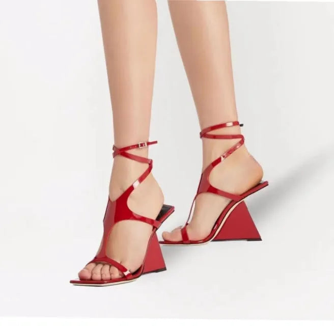 Women's black high heel sandals with 9.5cm heel, square toe, and button fastening.
