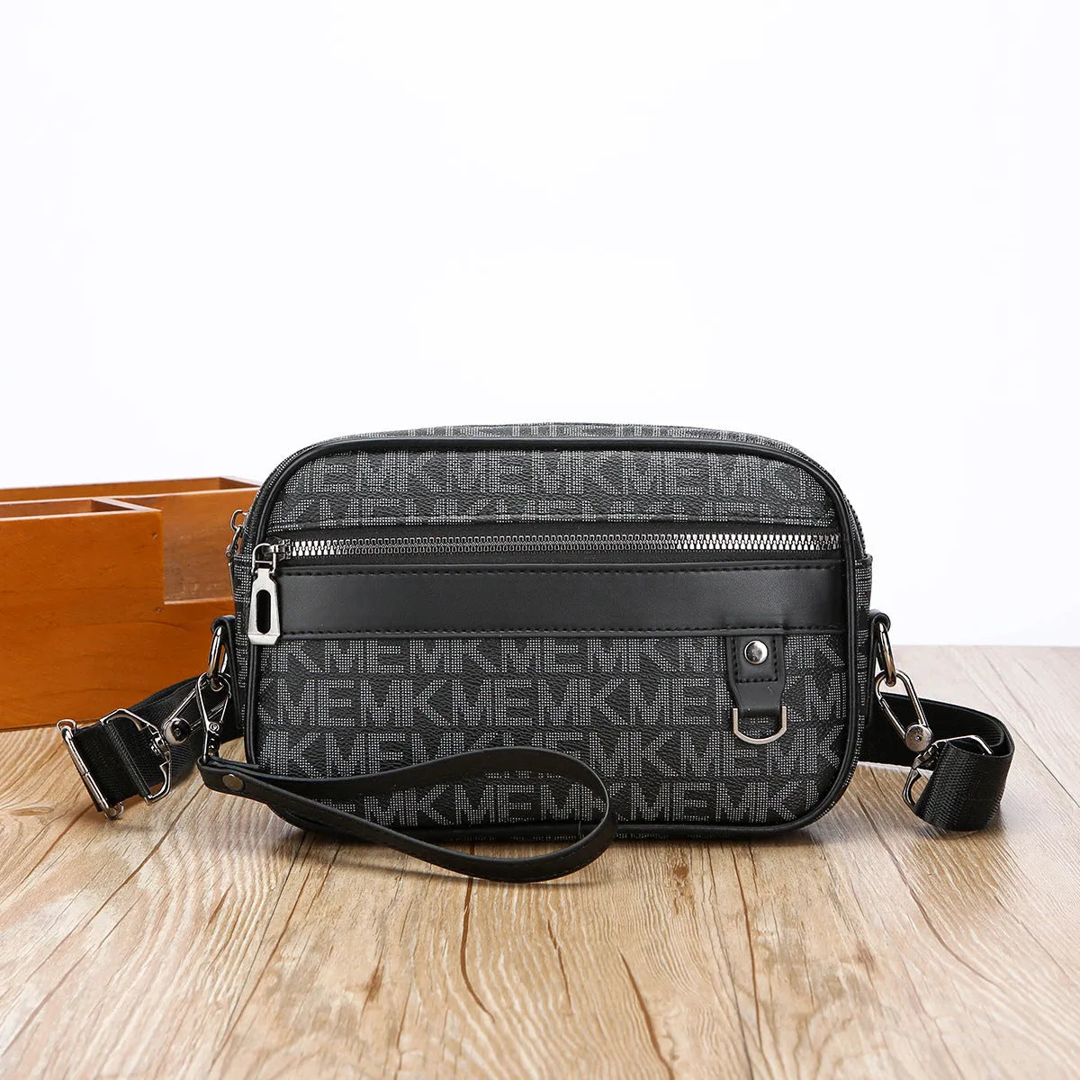 Men's black PU leather messenger bag with geometric pattern, showing horizontal shoulder carry design