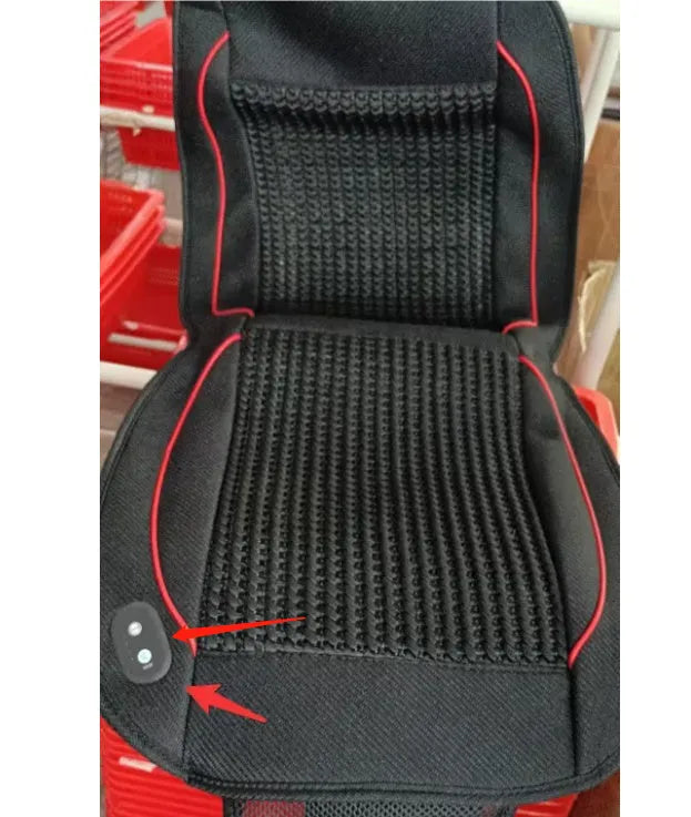 Square black car seat cushion with ventilation and massage functions on a car seat.