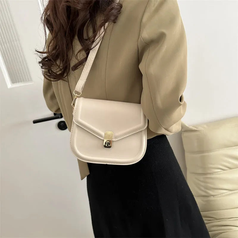 Soft PU leather shoulder messenger bag with clamshell opening in khaki colour, shown from the front.