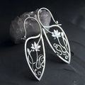 Silver lotus vine and geometric shape drop earrings with rhinestone accents