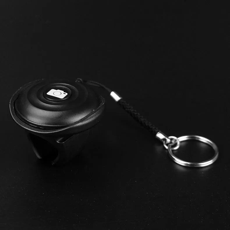 Black Bluetooth remote control for wireless camera and phone photography with 10m range