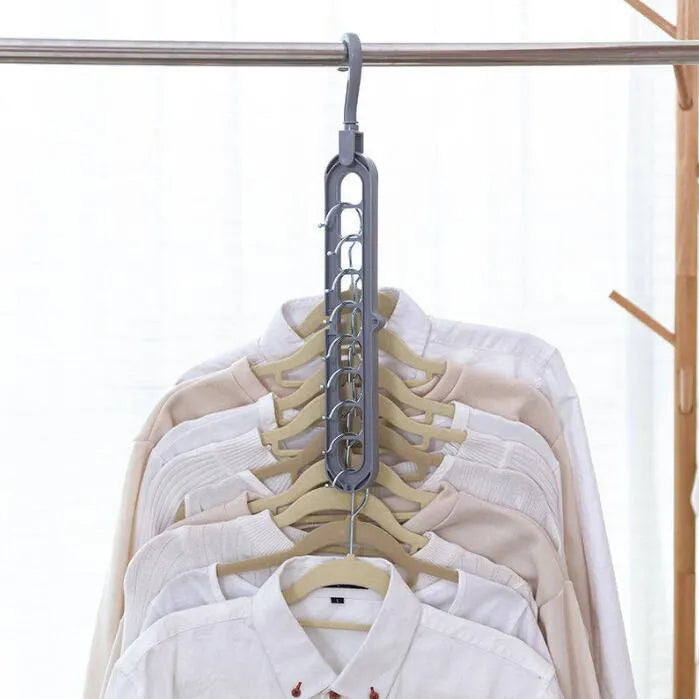 Pink plastic clothes hanger with a 360-degree rotating hook on a white background.
