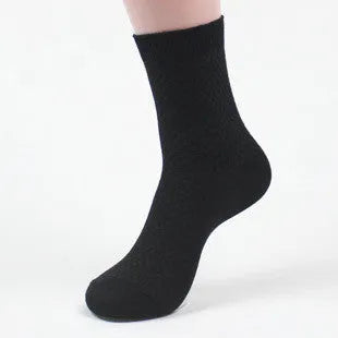 Men's bamboo fibre socks in a small square pattern, shown in neutral colours including grey and navy.