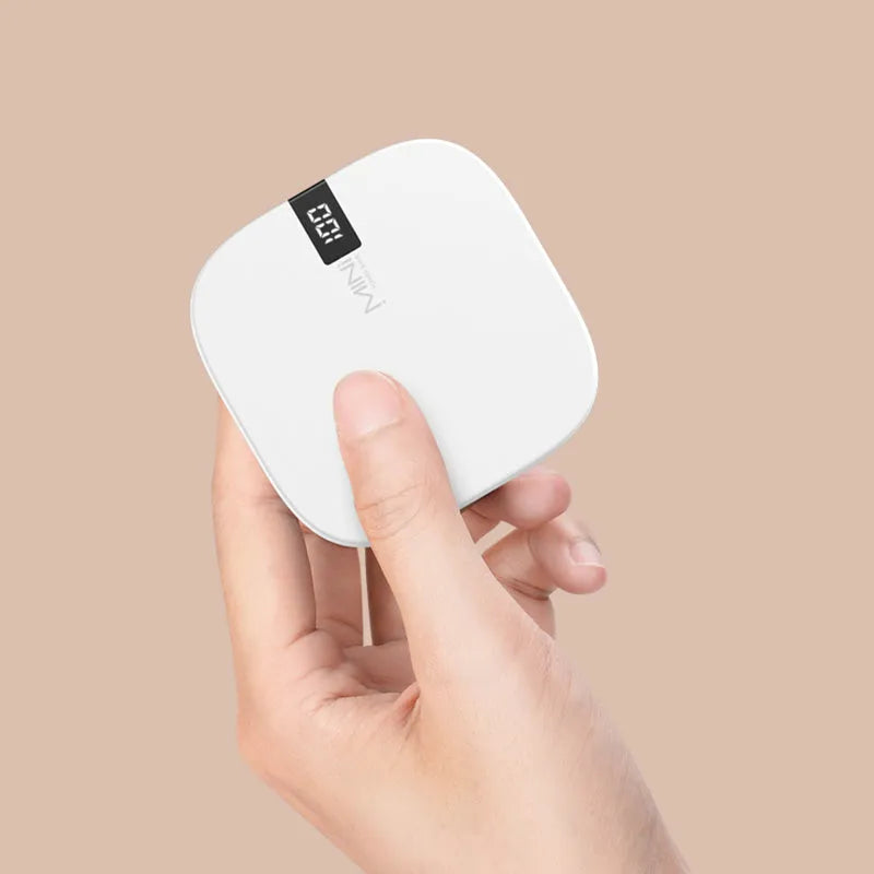 10000 mAh mini power bank with digital display in black, compact portable charger with two USB ports