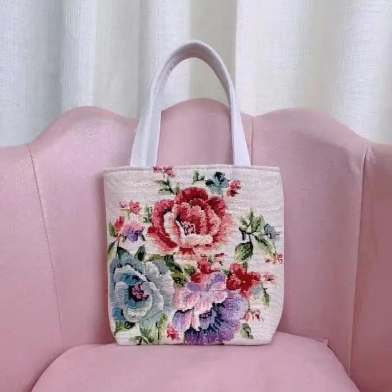 Double-sided embroidered canvas bag with gold wire detailing showing botanical pattern