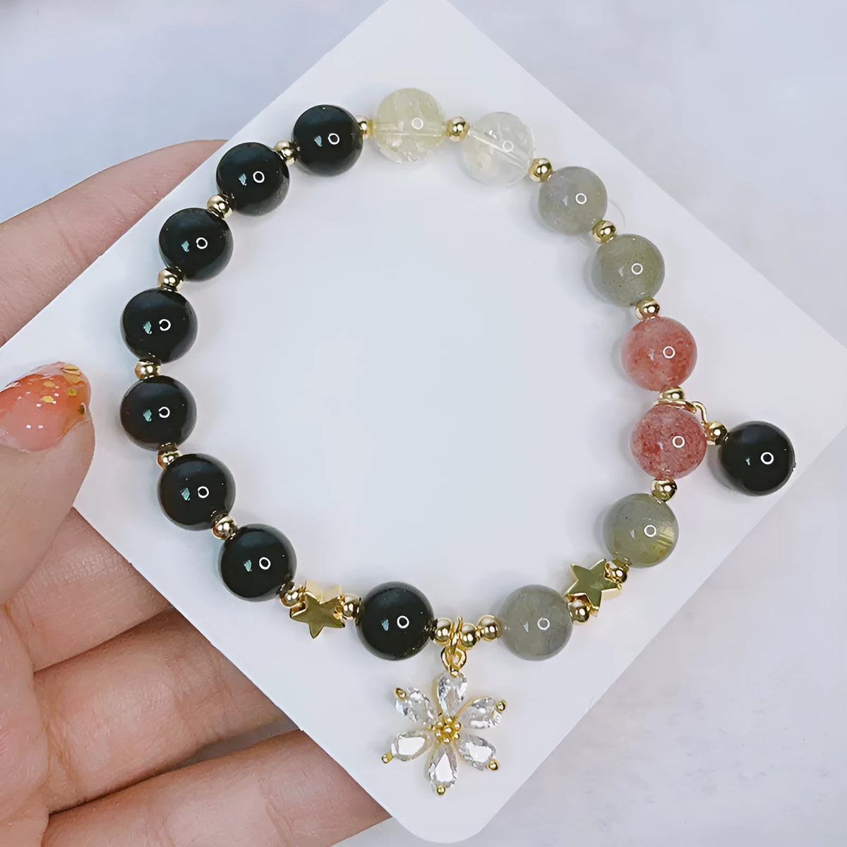 Silverstone bracelet with electroplated finish showing sweet-cool style and a choice of flower, love heart, or star charms.