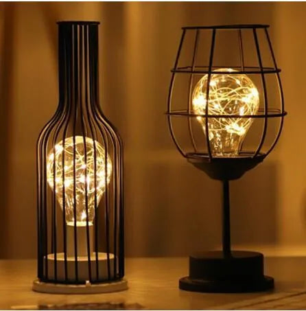 Minimalist hollow iron table lamp with warm white LED light in red wine bottle style