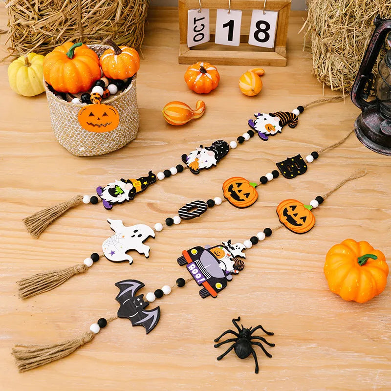 Resin Halloween pendant string with BOO ghost design hanging on a wall