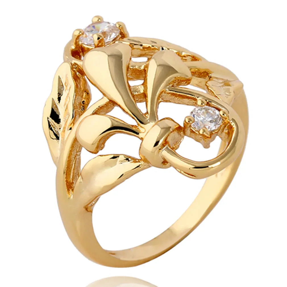 Gold tone copper ring with exaggerated irregular leaf design and white zircon stones, women's geometric band ring