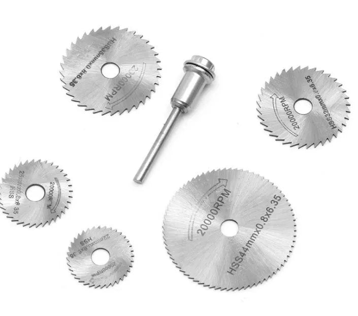 Set of six circular saw blades and a mandrel for woodworking tools.