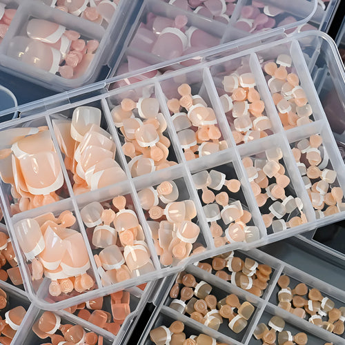120 piece box of French white edge nude artificial toenails in nine shades, square short shape for toes.