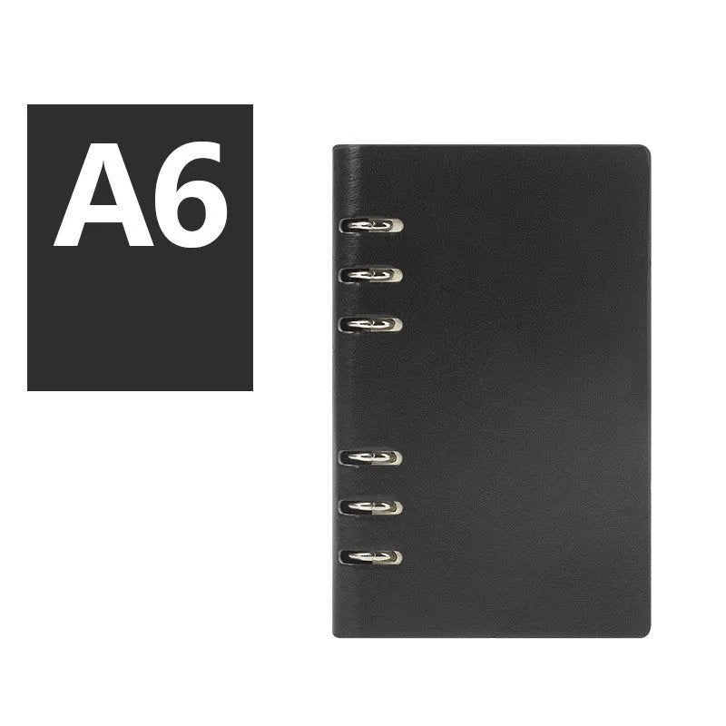 A5 loose-leaf business notebook with a black imitation leather cover, open to show beige paper.