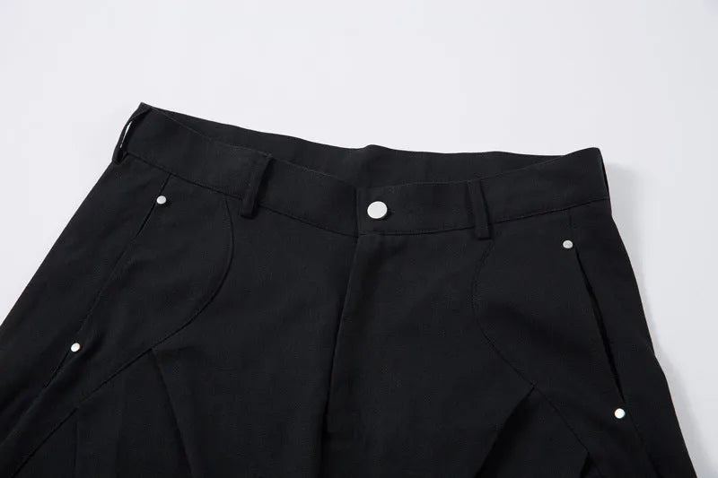 Men's black cotton pleated machete trousers with wide legs and elastic mid waist