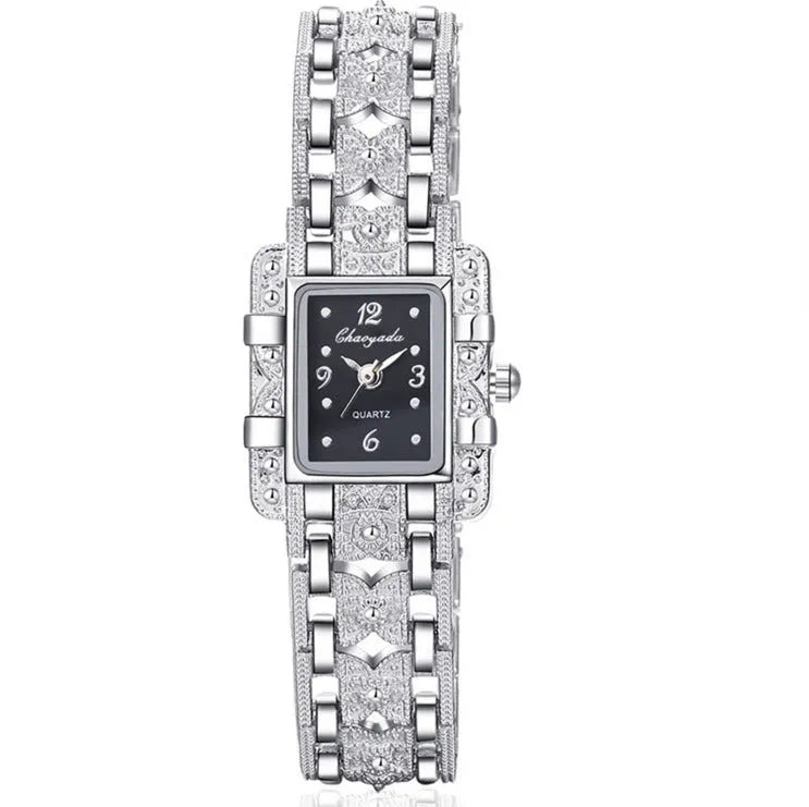Women's square bracelet watch with black dial surface on display in OPP packaging