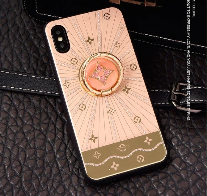 Rose gold and white gold iPhone ring stands with luxury diamond design on iPhone back.