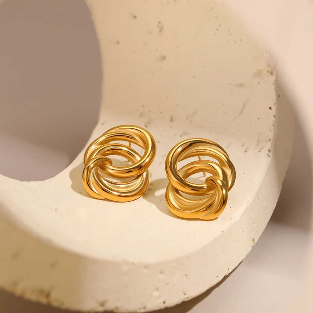 Gold geometric stud earrings with 18K electroplated finish on stainless steel