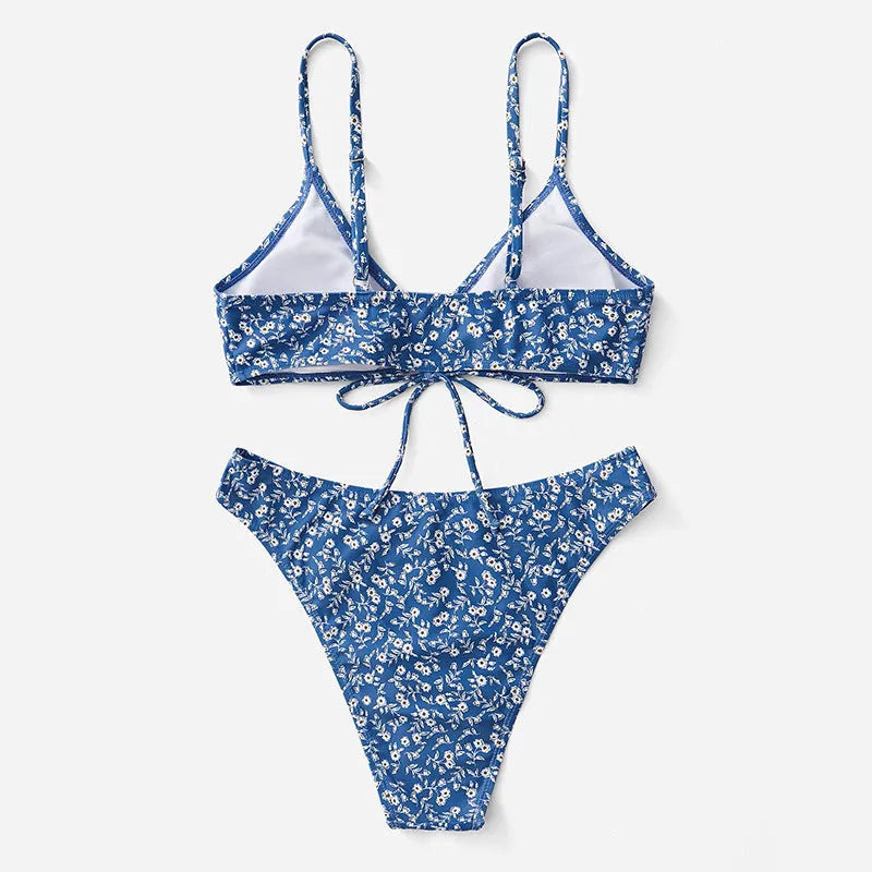 Blue women's swimsuit three-piece set with top and shorts, made from polyester fabric.