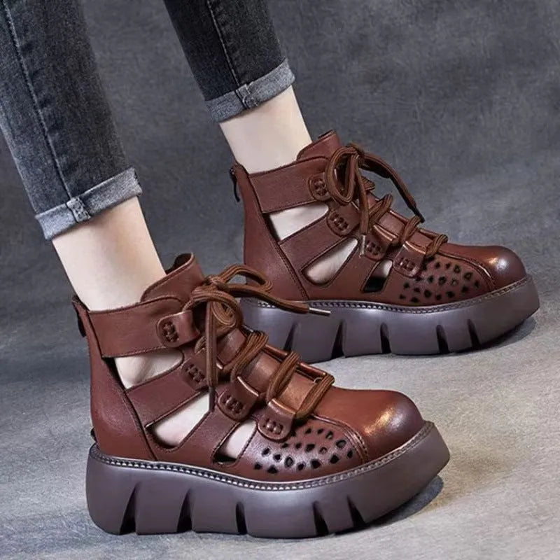 Women's black platform sandals with a hollow hole design and fish mouth toe, made from soft cowhide leather with a PU sole.