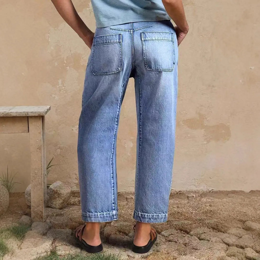 Casual cotton denim loose jeans trousers in light blue with washed finish, street hipster style
