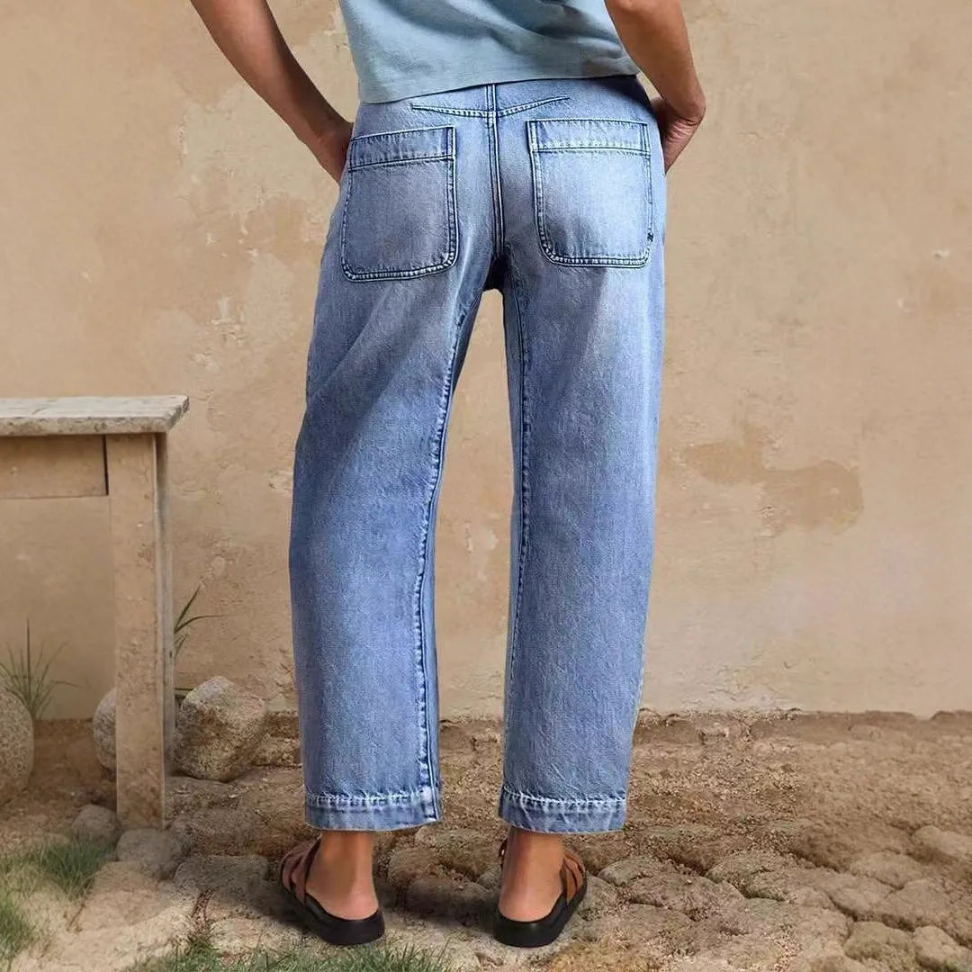 Casual cotton denim loose jeans trousers in light blue with washed finish, street hipster style