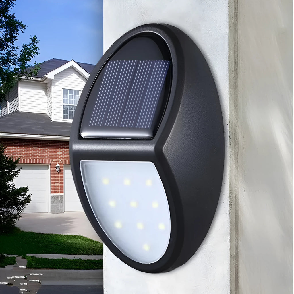 Black LED solar wall light with solar panel and automatic dusk-to-dawn sensor