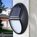 Black LED solar wall light with solar panel and automatic dusk-to-dawn sensor