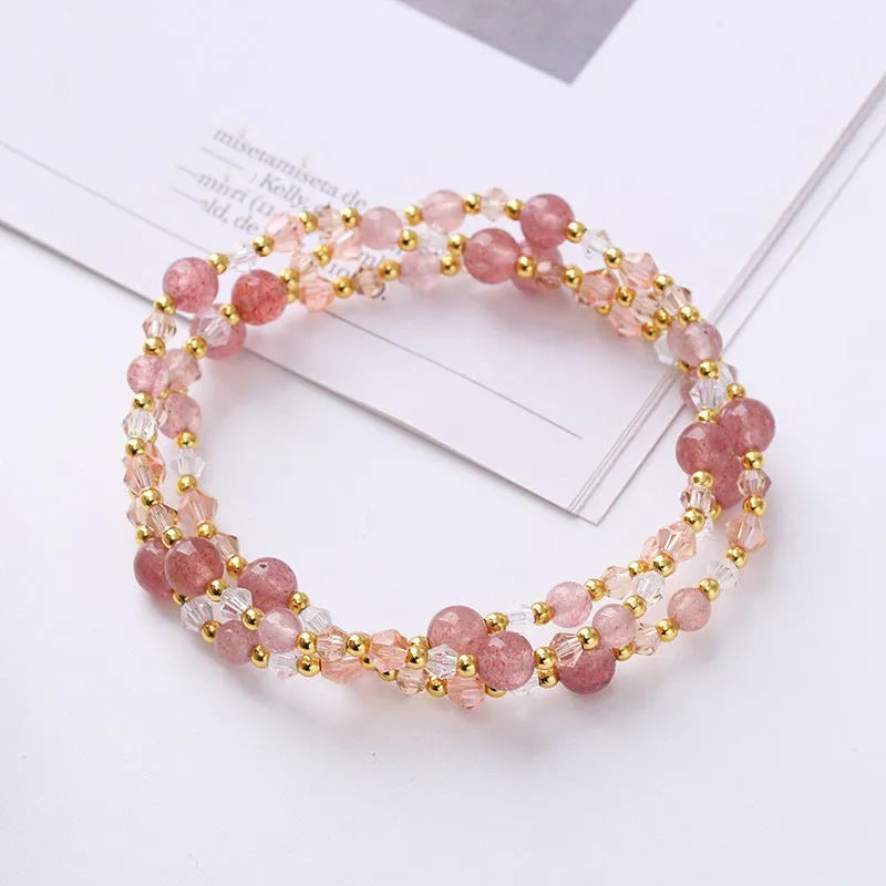 Women's adjustable bracelet with three rings of tourmaline, strawberry quartz, and amethyst crystal beads.