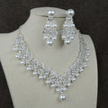 White pearl bridal jewellery set with necklace earrings and hair accessory with diamond accents style 0284